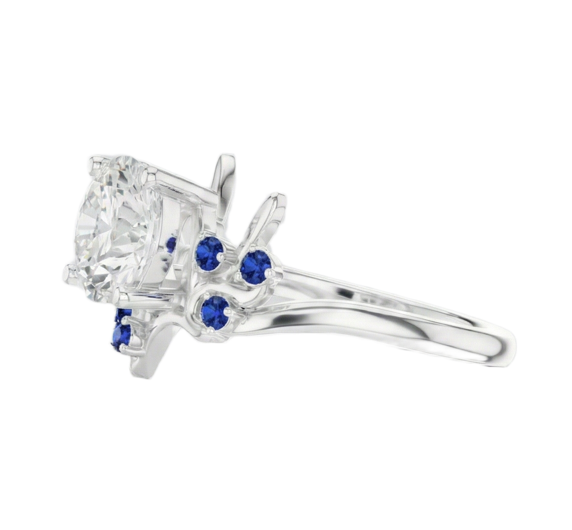 Silver ring with a central diamond and blue gemstones on a white background